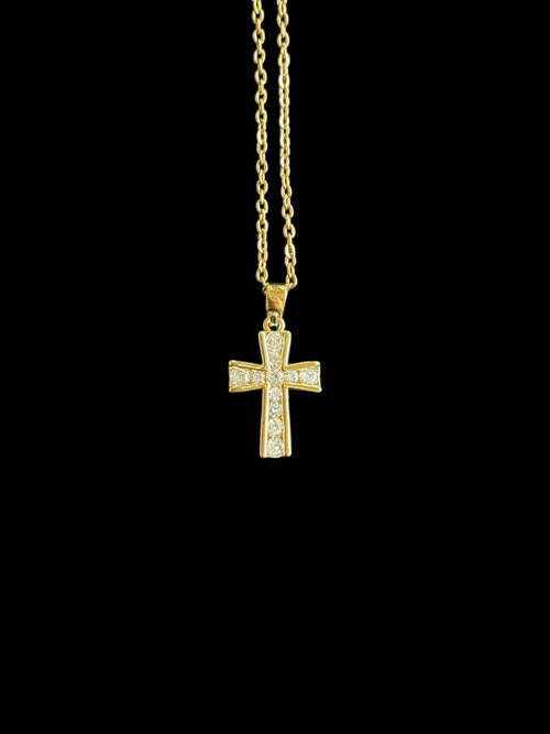 Bijou religieux plaqué or, croix lumineuse sur chaîne fine.